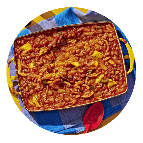 Casserole dish filled with Hawaiian Baked Beans.